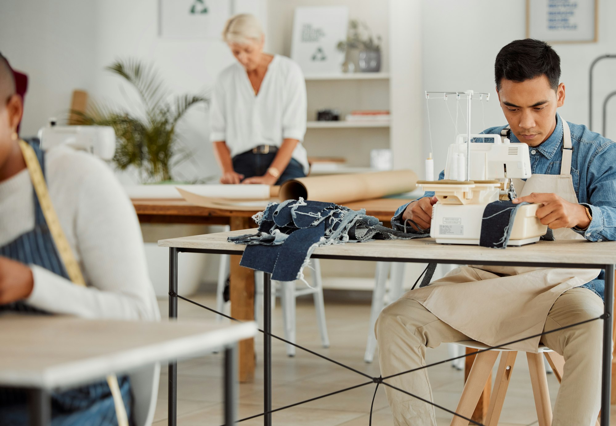 Fashion designer, young man and creative student in a workshop to stitch clothes. Factory worker, t