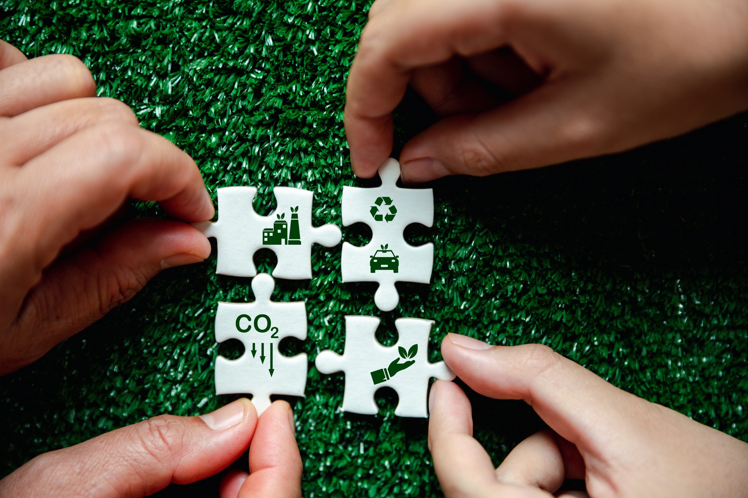 Companies are targeting net zero greenhouse gas emissions. Carbon credit concept.Tradable certificate to drive industry in direction of low emissions in efficiency cost. Jigsaw puzzle with decrease CO2