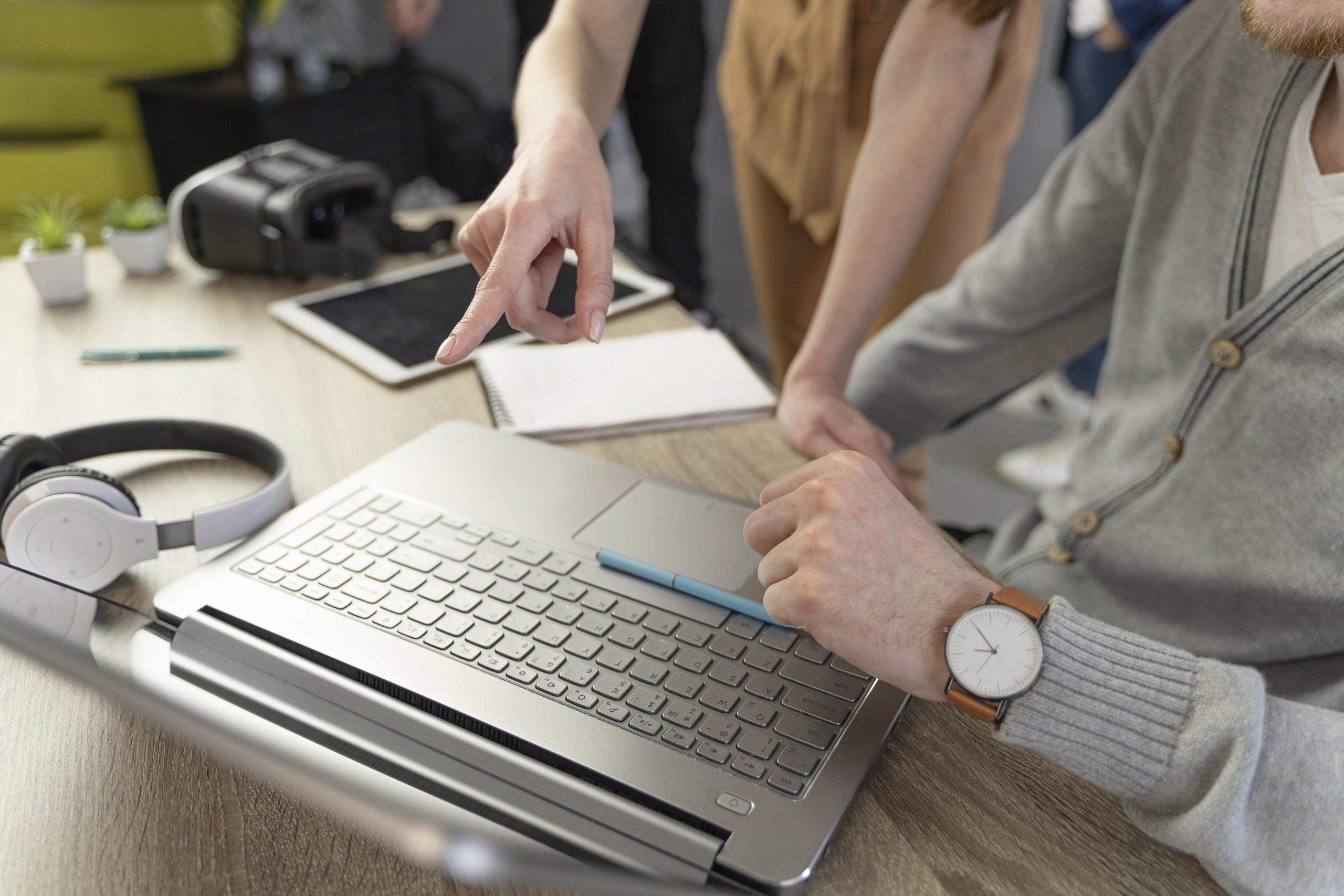 high-angle-man-woman-working-with-laptop-headphones