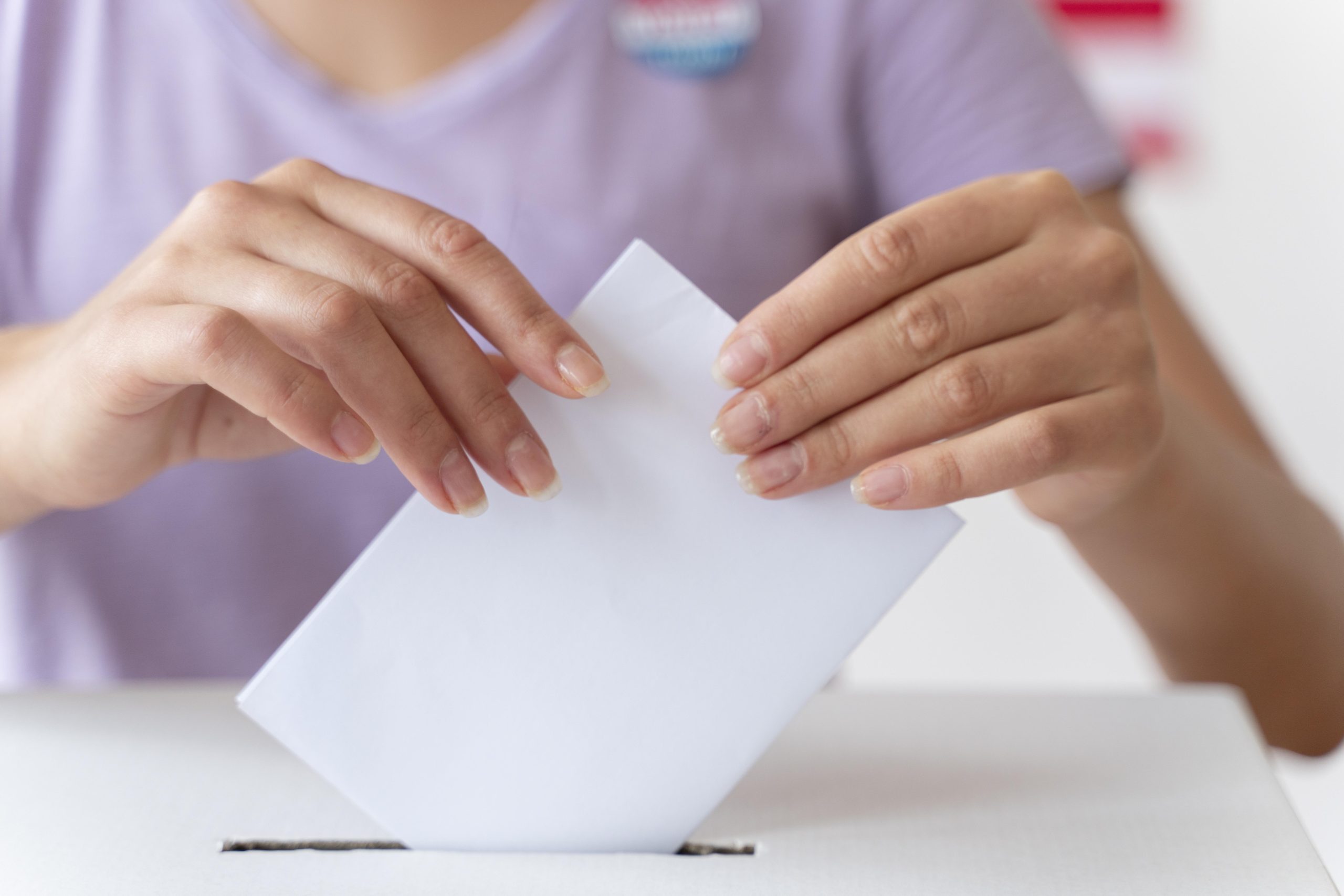 person-placing-its-vote-box (1)